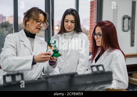 Female scientists examining new equipment in laboratory Stock Photo