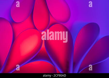 abstract pink and purple background with glowing bubbles of different shapes and colors Stock Photo