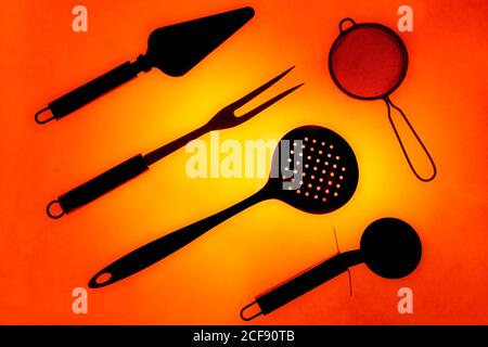 Set of various kitchen utensils on blue background Stock Photo