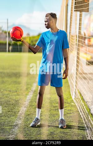 Black teenager on football field Stock Photo
