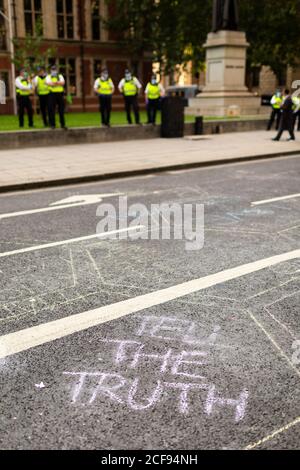 Chalked messages on road during Extinction Rebellion demonstration, Parliament Square, London, 1 September 2020 Stock Photo