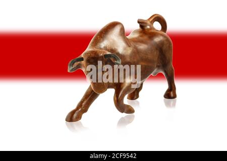 figure of a bull against the background of the white-red-white flag of Belarus. Stock Photo