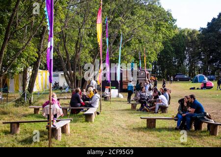 Socially distanced seating area at We Are Not a Festival socially distanced event in Pippingford Park - camping with a festival vibe Stock Photo