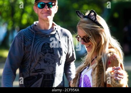 Cool couple dancing to live music at We Are Not a Festival socially distanced event in Pippingford Park - camping with a festival vibe Stock Photo