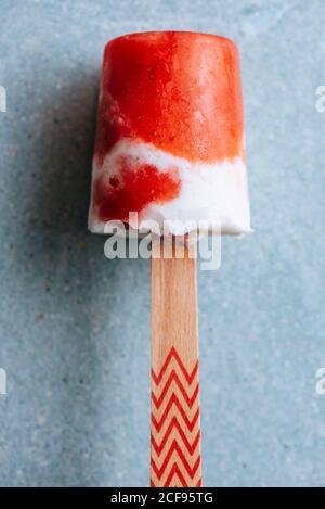 Close-up view of watermelon and cream popsicle laying on fancy plate Stock Photo