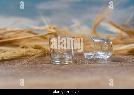 Clear whiskey shots on wooden table Stock Photo