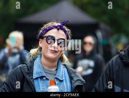 Pretty girl with a head scarf tied around her head at We Are Not a Festival socially distanced event in Pippingford Park, camping with a festival vibe Stock Photo