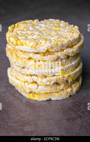 Crunchy rice cakes on grey marble table, front views, close-up Stock Photo