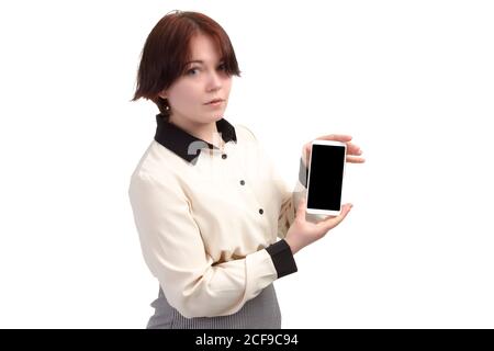 young businesswoman, or Manager, holds a smartphone in his hand. Isolate on white background Stock Photo