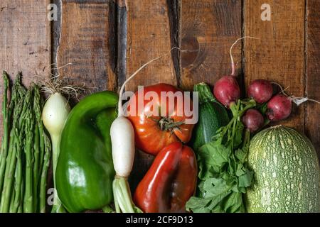 Fresh organic vegetables on a dark wooden table Stock Photo