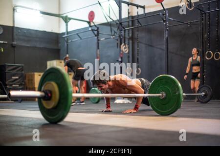 Fit man doing push-ups Stock Photo
