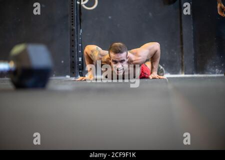 Fit man doing push-ups Stock Photo