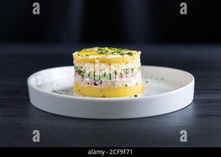 Fresh aromatic Lima cause of tuna with sliced vegetables Stock Photo