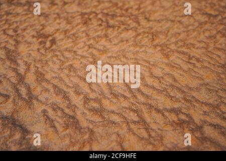 From above abstract relief rough gritty desert brown surface of background texture Stock Photo