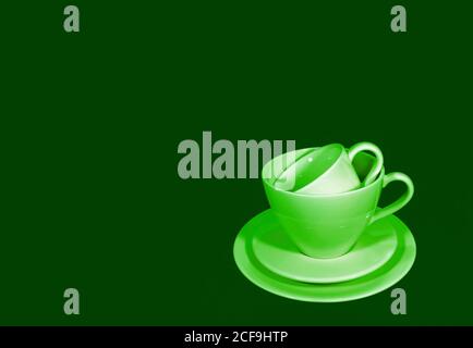 Pop art style green color tone stack of two different size of coffee cup sets Stock Photo