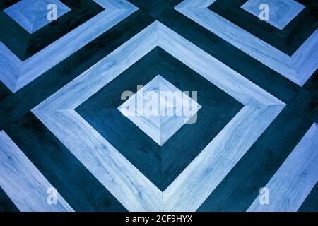 Light blue and navy blue geometric pattern wooden floor surface Stock Photo