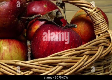 Closeup shot of an arrangement of ripe red apples lying in a basket Stock Photo