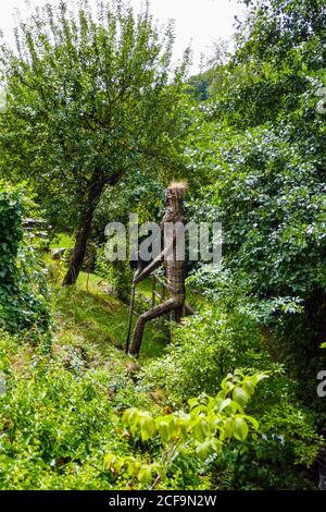 Wickerwork man on the woods, Soultzeren, Munster, Vosges Mountains, France Stock Photo