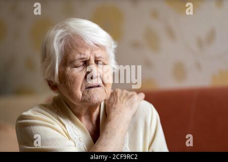Senior woman suffering from back pain Stock Photo