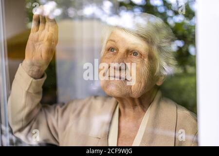 Portrait of an elderly woman in a state of worry at home