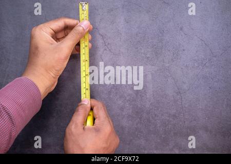 measurements on a wood with a tape measure tools. Stock Photo