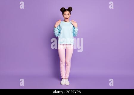 Full size photo of crazy positive cheerful astonished girl youngster hear wonderful novelty impressed scream wear pink jumper shoes isolated over Stock Photo