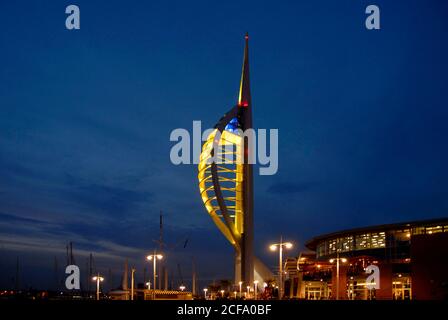 The Spinnaker Tower, Gunwharf Quays, Portsmouth, Hampshire, England, lit at night with yellow light Stock Photo