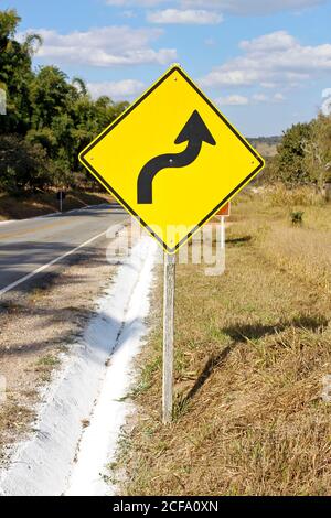 warning traffic sign - sharp right curve - S curve Stock Photo