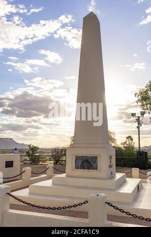 Monument at the Anzac Hill Memorial. Dedicated to  members of the army who served in World War I and II. Sunset time, sun hiding behind the white obel Stock Photo