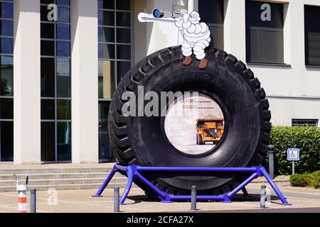 Clermont-Ferrand , auvergne / France - 08 10 2020 : Michelin bibendum front of corporate museum with biggest tyre in the world made in spain and usa Stock Photo