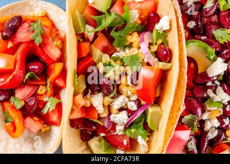 A close-up of Mexican food. Vegetarian tacos with vegetables, shot from the top Stock Photo