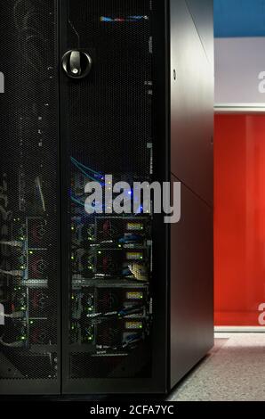Interior of modern illuminated facility with metal server Stock Photo