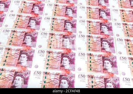50 pound notes laid out featuring British monarch Queen Elizabeth II Stock Photo