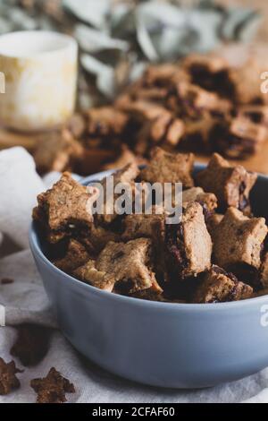 Bowl with tasty cookies on table Stock Photo