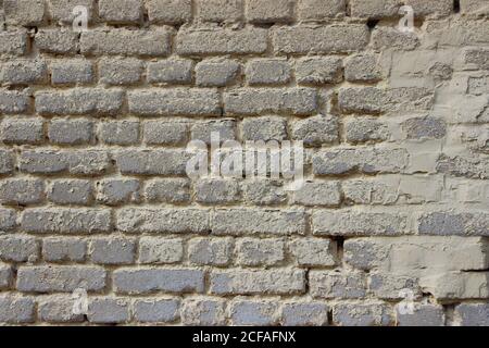 old weathered gray brick wall vintage style background Stock Photo