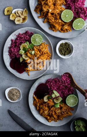 Plates with red quinoa and chicken curry Stock Photo