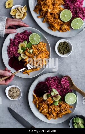 Plates with red quinoa and chicken curry Stock Photo
