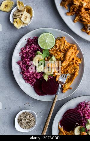 Plates with red quinoa and chicken curry Stock Photo