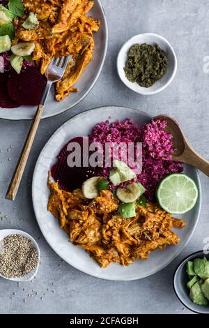 Plates with red quinoa and chicken curry Stock Photo