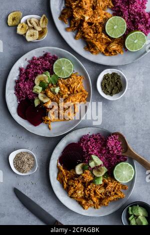 Plates with red quinoa and chicken curry Stock Photo