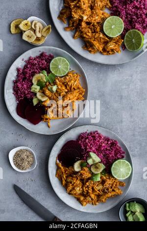 Plates with red quinoa and chicken curry Stock Photo