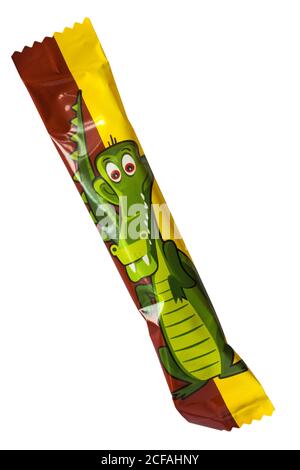individual Fruit-tella zoomania zoo mania chewy sweet candy with fruit juice removed from packet showing crocodile isolated on white background Stock Photo