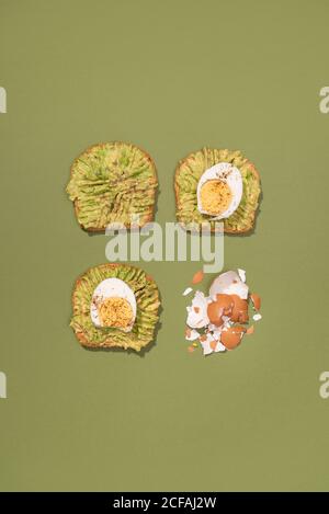 Top view of avocado toasts with boiled eggs for breakfast Stock Photo