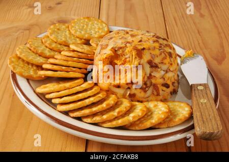 Cheddar cheeseball with sliced almonds and crackers Stock Photo