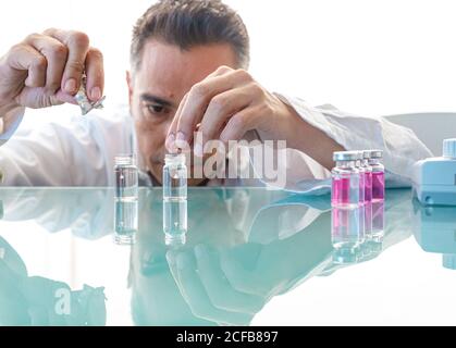 Assistant making test with samples in laboratory Stock Photo