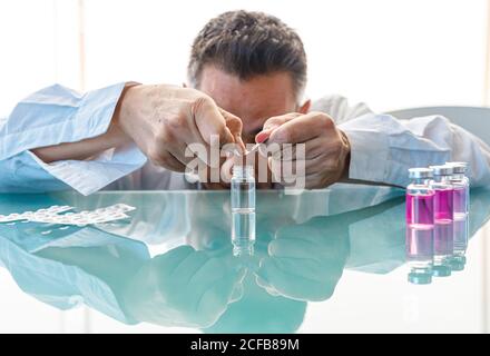 Assistant making test with samples in laboratory Stock Photo
