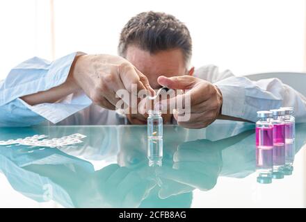 Assistant making test with samples in laboratory Stock Photo