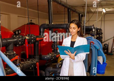 Safety inspector making notes in journal Stock Photo