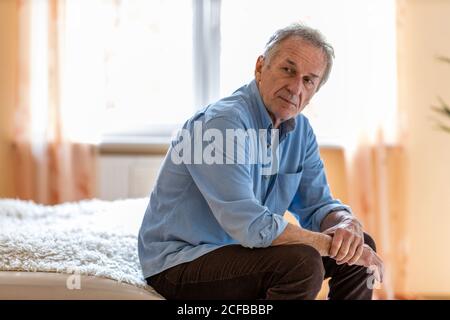 Portrait of senior man looking depressed Stock Photo