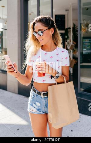 Cheerful Woman leaving restaurant Stock Photo
